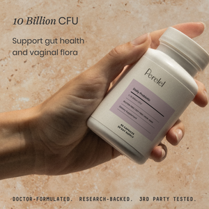 Hand holding a bottle of Perelel daily probiotic supplement with text on gut health and support.