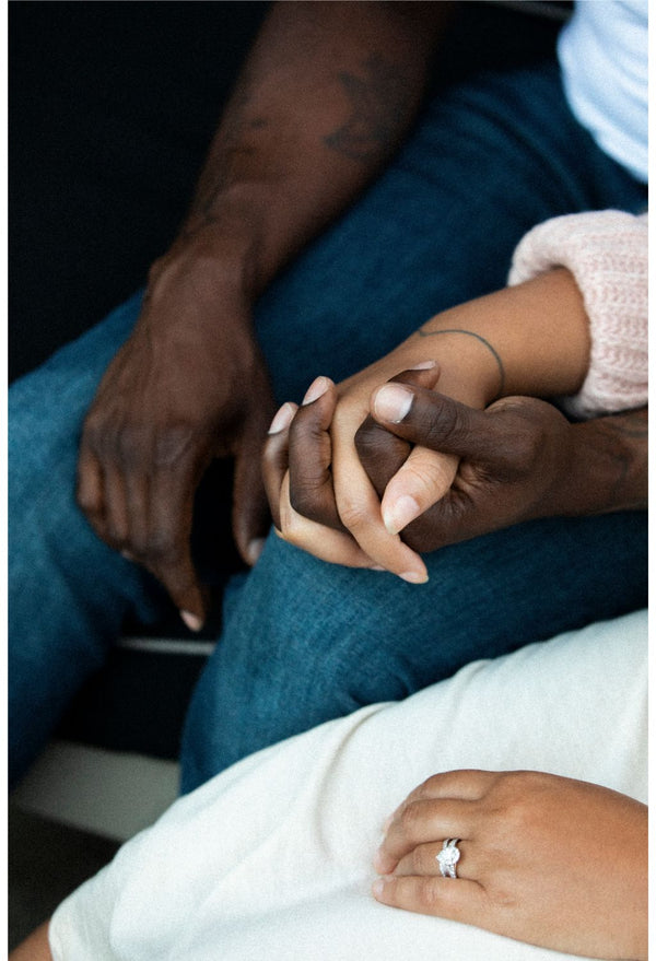 Man and woman holding hands, infertility, husband and wife