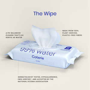 Coterie 99% water wipes shown in a clean studio-style graphic with callout text. A light blue wipe packet with blue lettering sits on a light beige background, and a white wipe is pulled from the top.