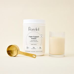 Perelel triple-support protein container with a glass of protein shake and a gold scoop on a light background