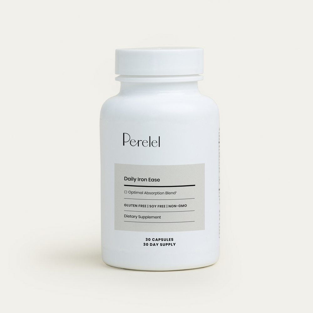 White supplement bottle labeled 'Perelel'
 on a light beige background