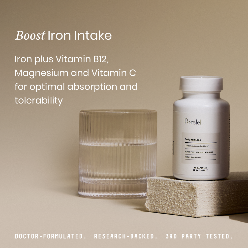 Perelel iron supplement bottle with a glass of water on a beige background