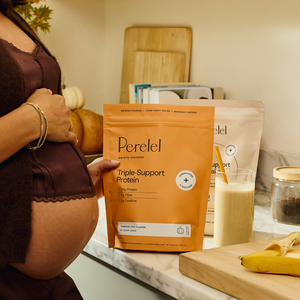 Pregnant woman holding gusset bag of pumpkin chai triple-support Protein 