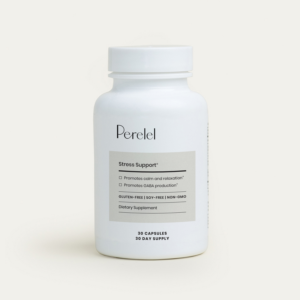 White supplement bottle labeled 'Perelel' on a light beige background