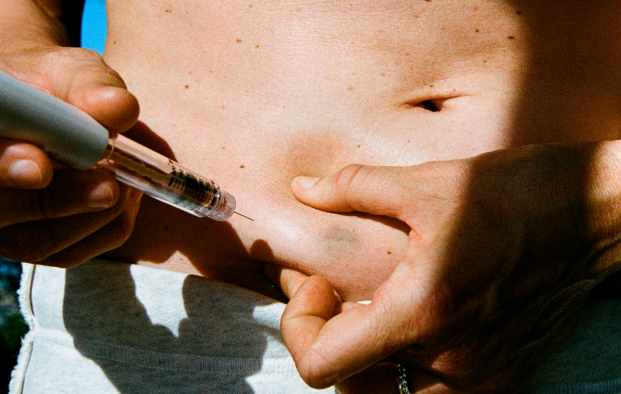 person holding stomach 