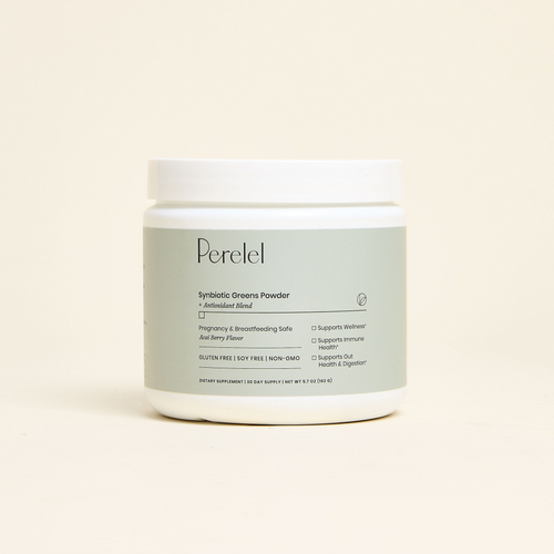 Jar of Perelel Greens Powder on a beige background