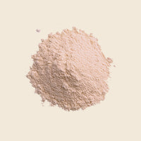 pinkish powder on a beige background